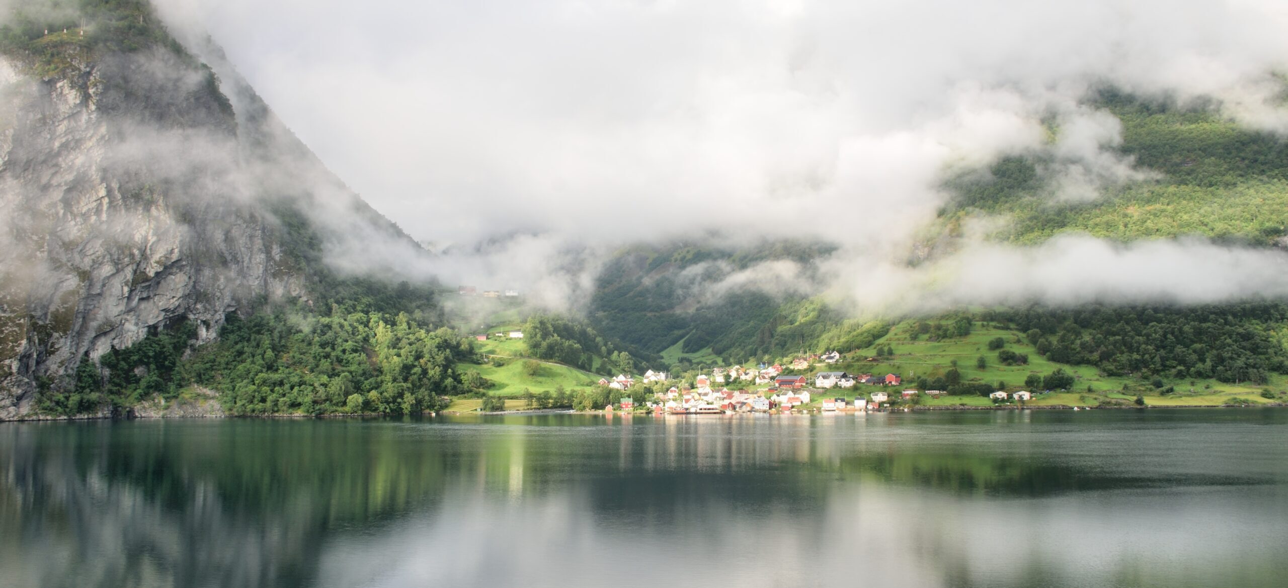 Norwegian village with refections on in fjords